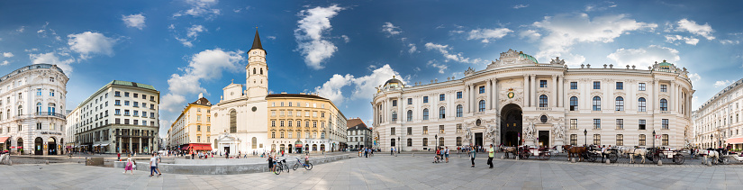 VIENNA - MAY 3: Panorama of the Hofburg and the Church of Saint Michael (Michaelerkirche) at Michaelerplatz in Vienna, Austria on May 3, 2018.