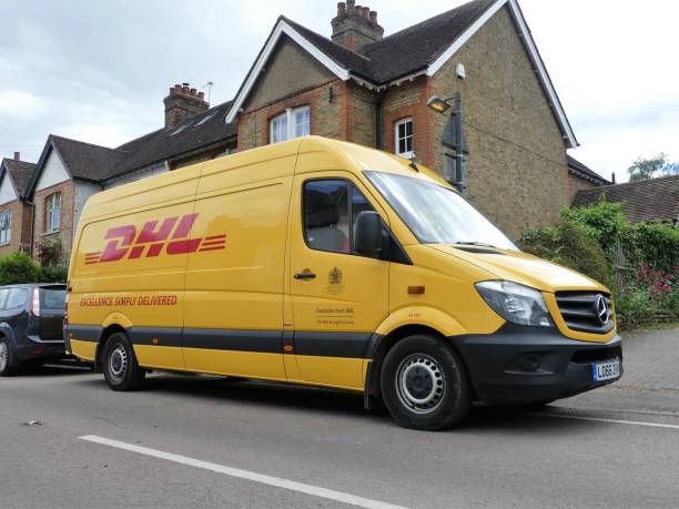 dhl mercedes sprinter delivery van. dhl is an international company providing delivery services. - driving delivery van global business dhl imagens e fotografias de stock