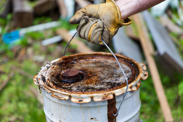 istock Man holding a rusted bucket 1246485008