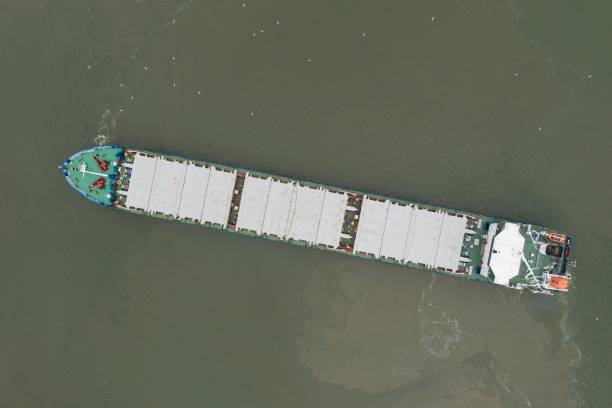 istock Commercial ship crossing the river. 1246486393