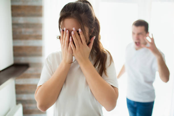 istock Young woman and man in room arguing 1246488000