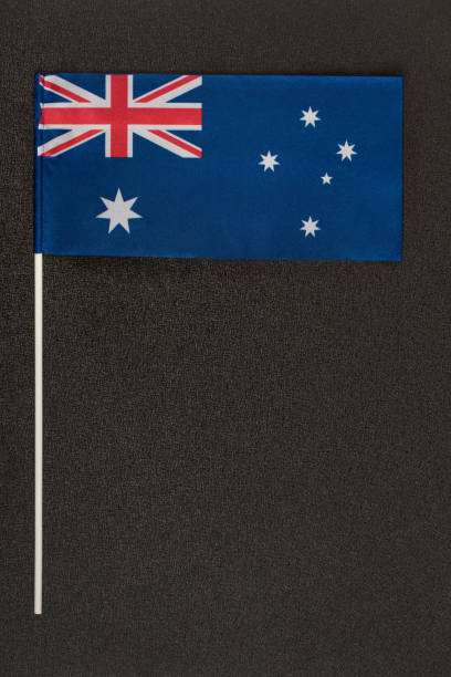 istock Table flag of Australia on black background. Vertical frame 1246488015