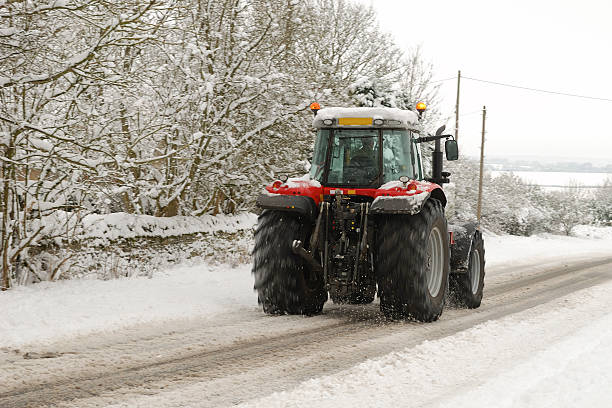 istock Tractor on snowy road 124648850