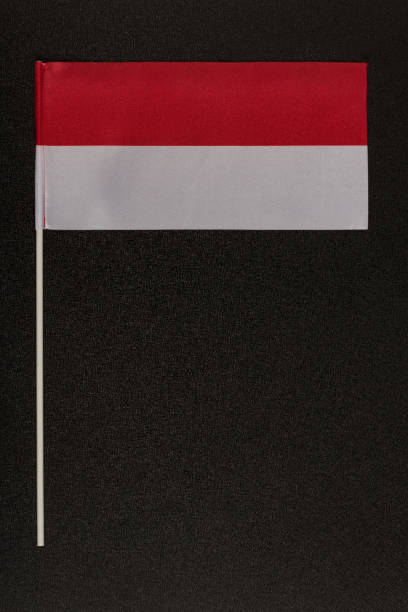 istock Table flag of Poland on a black background. Red-white flag. Vertical frame 1246488546