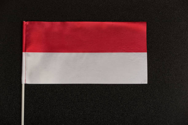 istock Table flag of Poland on a black background. Red-white flag. 1246488554