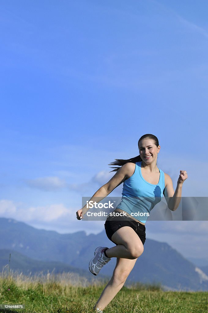 happy life woman running in the middle of nature Adult Stock Photo