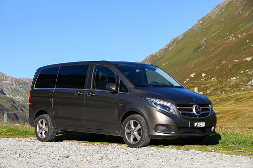 Saint Gotthard Pass, Switzerland - September 13, 2019: Brown van Mercedes-Benz Viano (W447) at the Alpine countryside.