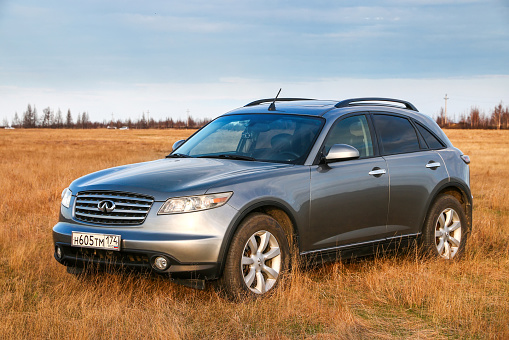 Novyy Urengoy, Russia - May 19, 2020: Crossover Infiniti FX35 at the countryside.