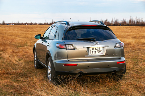 Novyy Urengoy, Russia - May 19, 2020: Crossover Infiniti FX35 at the countryside.