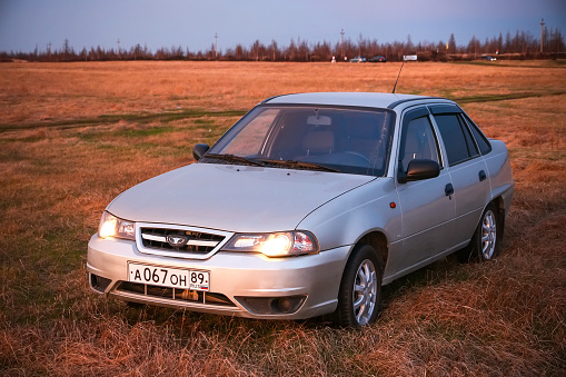Novyy Urengoy, Russia - May 19, 2020: Compact car Daewoo Nexia at the countryside.