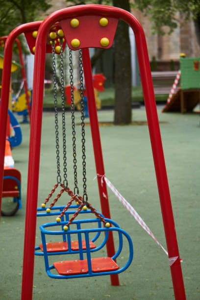 istock An empty playground without children with striped red and white warning tape, limitations quarantined for Covid19 coronavirus 1246500051