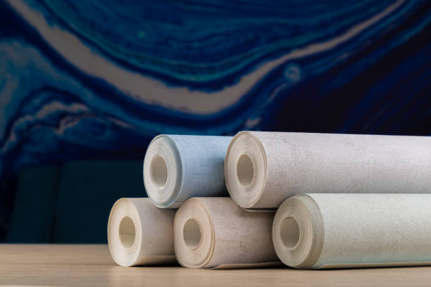 istock several rolls of multi-colored paper wallpaper on a wooden table 1246512055