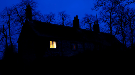 A closeup of a beautiful house at night