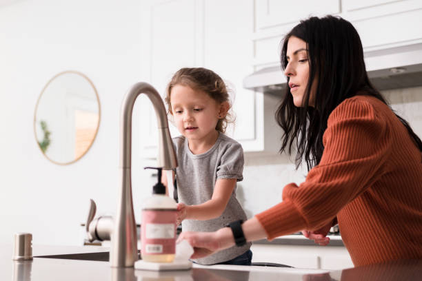 istock Mom and daughter washing hands during COVID-19 quarantine 1246537757