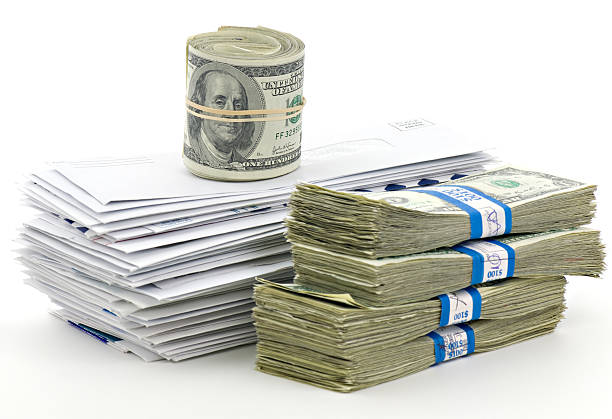 istock Stack of Unpaid Bills and Envelopes Isolated on White 124654503