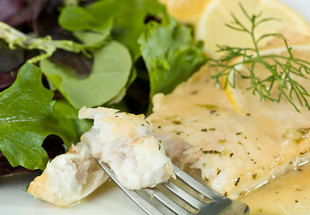 istock White Fish Fillet in lemon and herbs sauce 124654606