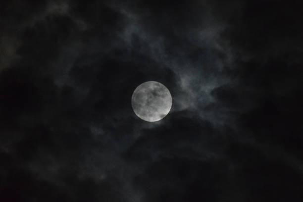 Tamil Nadu, India - June 06, 2020 : The penumbral lunar eclipse hidden inside clouds Tamil Nadu, India - June-06-2020: The penumbral lunar eclipse popularly called the Strawberry Moon penumbral lunar eclipse stock pictures, royalty-free photos & images