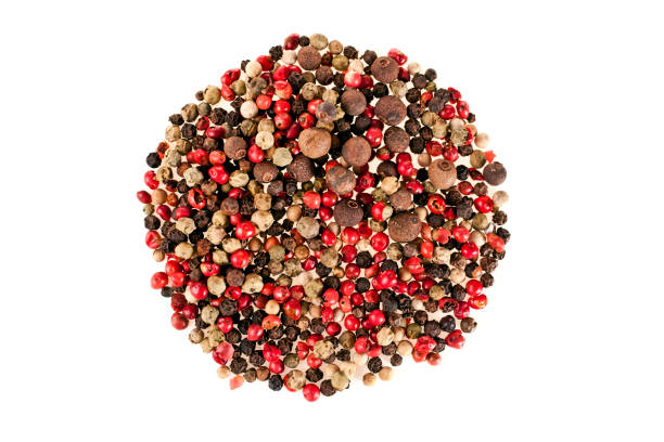 Peppercorns in the round shape A variety of peppercorns in the round shape isolated on a white background. Top view. pink pepper spice ingredient stock pictures, royalty-free photos & images