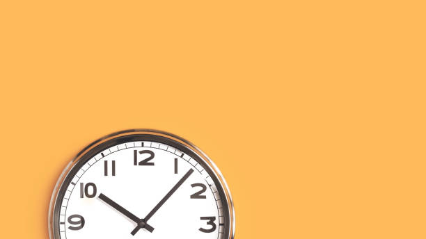One big wall clock top part on orange background Time concept. Top part of white wall clock face on pastel saffron orange background flat lay. Close up copy space, time management or opening hours. Summer or winter daylight saving time change banner deadline photos stock pictures, royalty-free photos & images