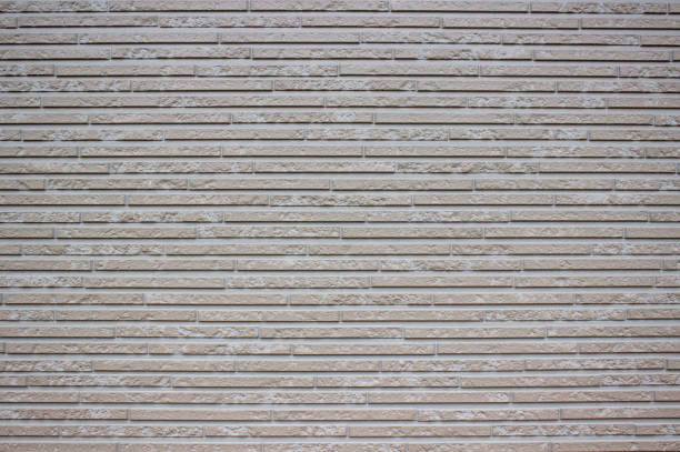 istock Gray background of small bricks on the wall. 1246566027
