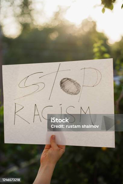 Woman Holding White Paper With Text Stop Racism Stock Photo - Download Image Now - Anti-racism, Community, Police Force