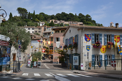 Villeneuve-Loubet, France - 1st August, 2014: Street and buildings in a village. The village is overlooked by the Château de Villeneuve-Loubet. Villeneuve-Loubet is a commune in the Alpes-Maritimes department in the Provence-Alpes-Côte d'Azur region in southeastern France.