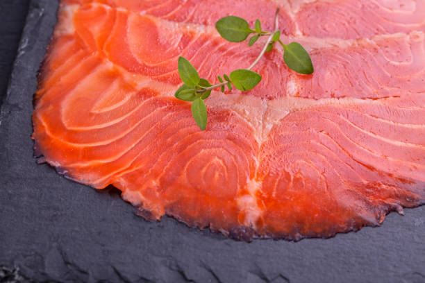 istock Salted salmon sliced on a slate board 1246574398