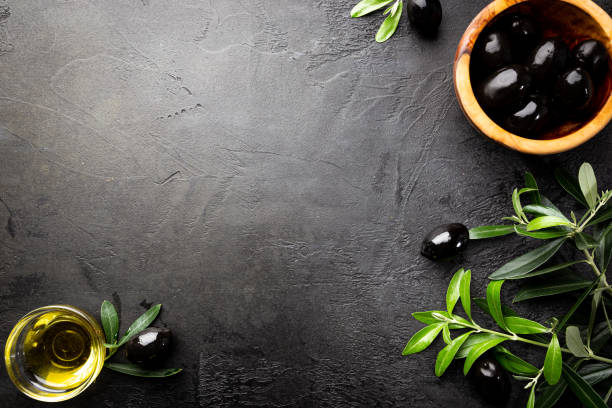 istock Black olives and olive oil 1246600804