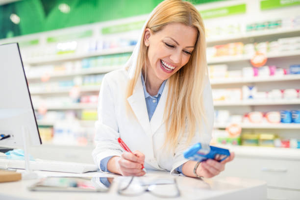 istock Happy pharmacist prescribing a medicine. 1246605087
