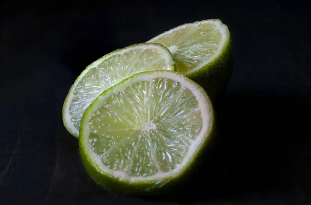 Lemon slices in black background and macro photography or close up image