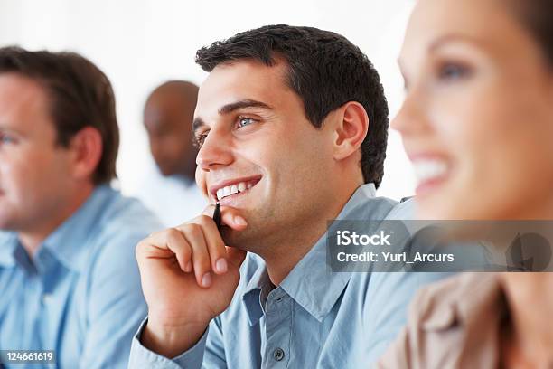 Business Man Smiling During Seminar Stock Photo - Download Image Now - 20-29 Years, Adult, Audience