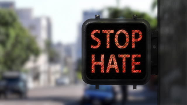 Stop Hate. Have Hope—Medium shot of Walk Signal with hopeful social message