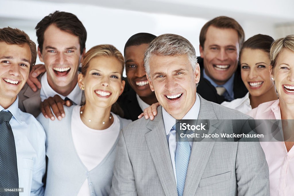 Successful group of business people smiling together Portrait of a happy, senior manager with his team at office 30-39 Years Stock Photo