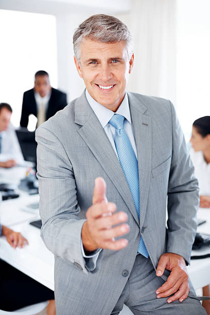 istock Senior manager welcoming you to his workplace 124662340