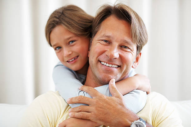 istock Young girl hugging her father 124662396