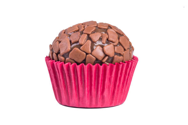 Traditional handmade Brazilian chocolate candy called brigadeiro. Isolated on white background.