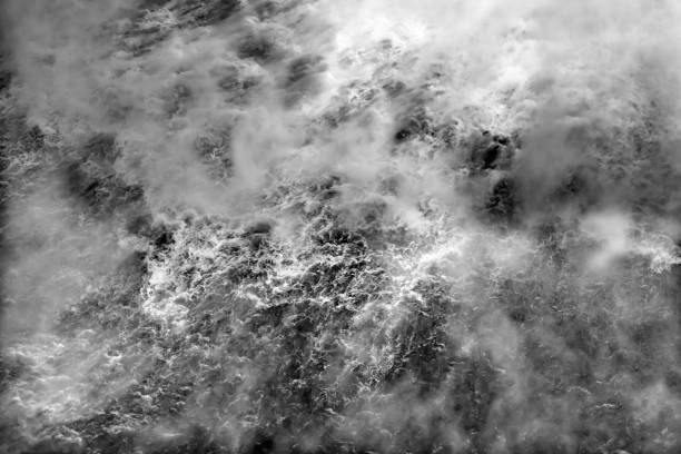 black and white waterfall on dark background