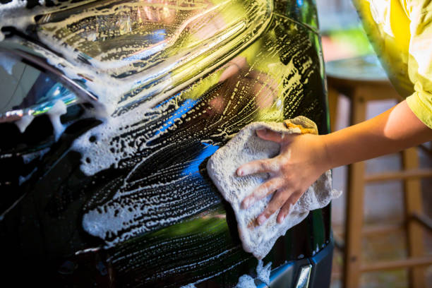 istock Selective focus to Asian boy washing black car 1246662674