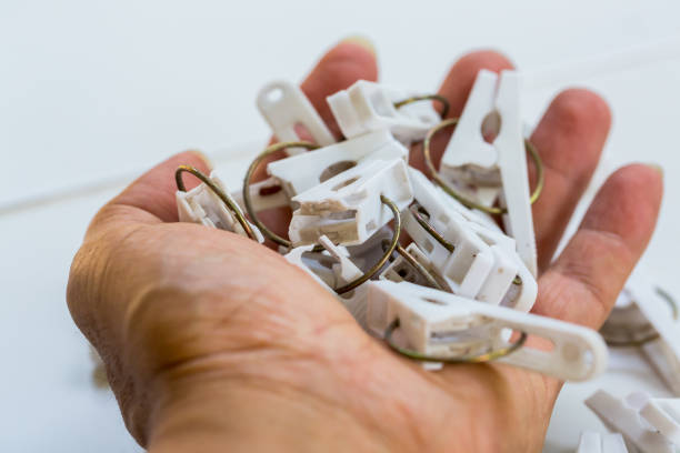 Many old plastic clip broken in hand are recyclable waste. Recycle waste from home management concept.