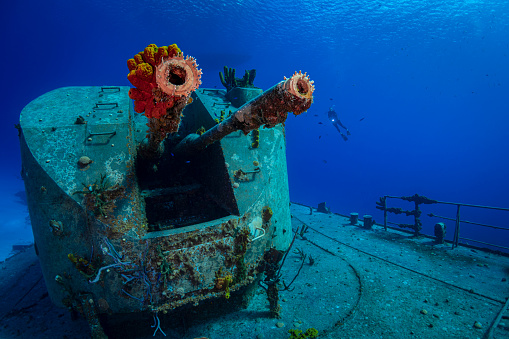 View of the MV Captain Keith Tibbetts shipwreck and female diver in Cayman Brac - Cayman Islands