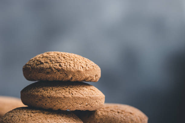 istock Stack of butter cookies on blue background with copy space. 1246672710