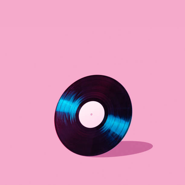 istock Shiny LP vinyl record lit with blue and red colorful neon light on abstract background with copy space 1246689424