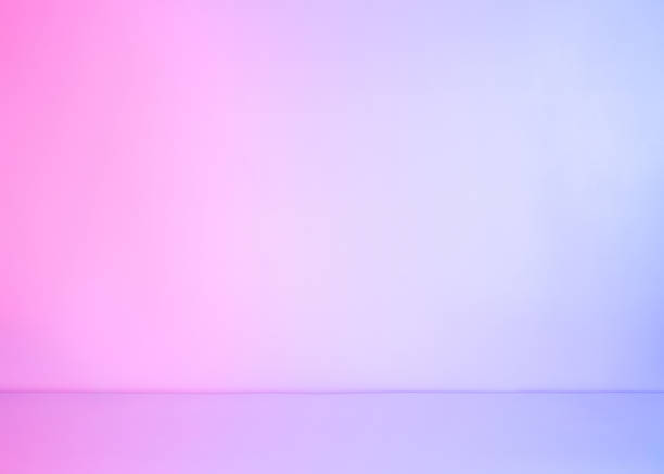 istock Abstract white empty background lit with colorful pink and blue neon pastel light 1246689454