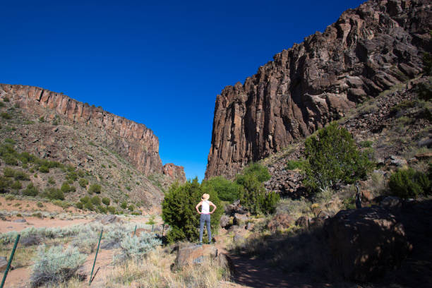 istock Santa Fe, NM: Woman Admiring Diablo Canyon Under Sun 1246699614