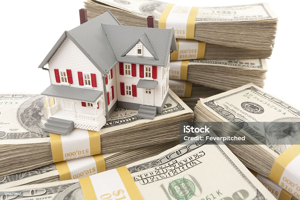 Small House with Stacks of Hundred Dollar Bills  Abundance Stock Photo