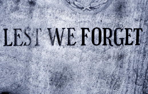 Lest We Forget written on a memorial stone