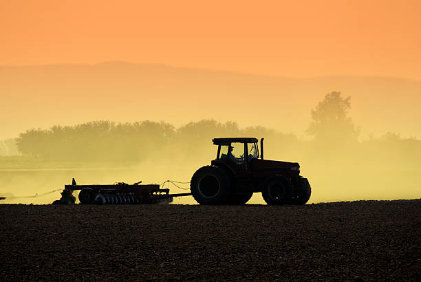 Tractor Silhouette  sowing photos stock pictures, royalty-free photos & images