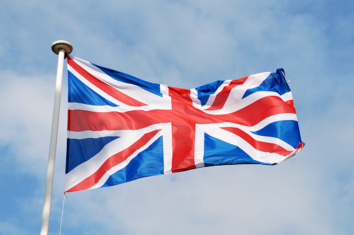 Official Flag of United Kingdom of Great Britain and Northern Ireland against white background, empty space for text.