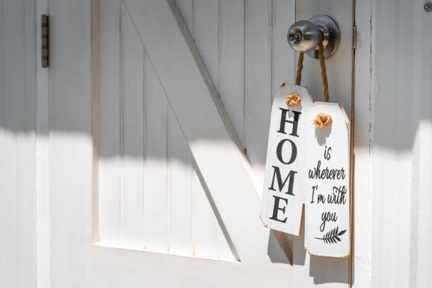 istock Wooden tags were hang on a white door and white wall 1246817664
