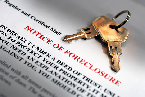 Notice of Foreclosure and House Keys  foreclosure stock pictures, royalty-free photos & images